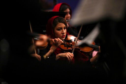 Image result for At Tehran symphony, music lovers seek escape from reality