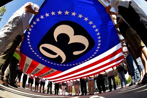 In a year of restrictions, virus changes Sept. 11, too