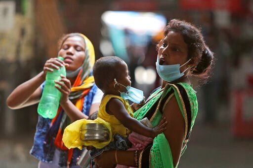 Asia Today: India adds 96K virus cases, orders some retests