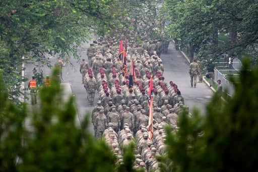 Military parade barrels through nation's capital with tanks, troops and 21-gun salute