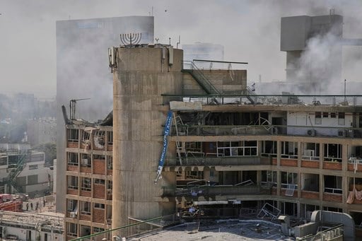 The Latest: Israel threatens Iran's supreme leader as Iranian strikes wound over 200