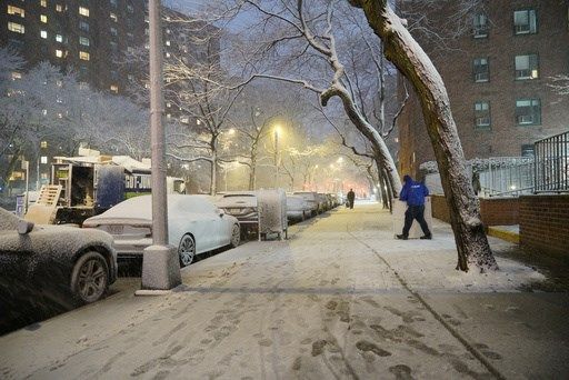 New York City hunkers down under blizzard warnings and a travel ban as winter storm hits Northeast