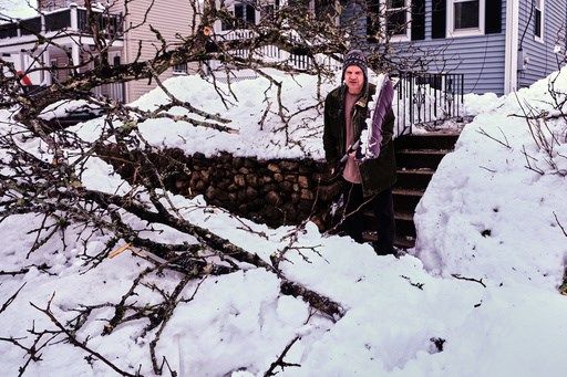 More snow falls on the Northeast US, where huge piles remain from the last storm